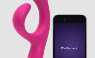 We-Vibe Nova sex toy in pink with app on mobile phone next to it
